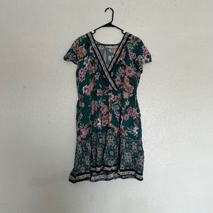 Cute summer dress! Flowery and comfortable. Maurice’s size Large
